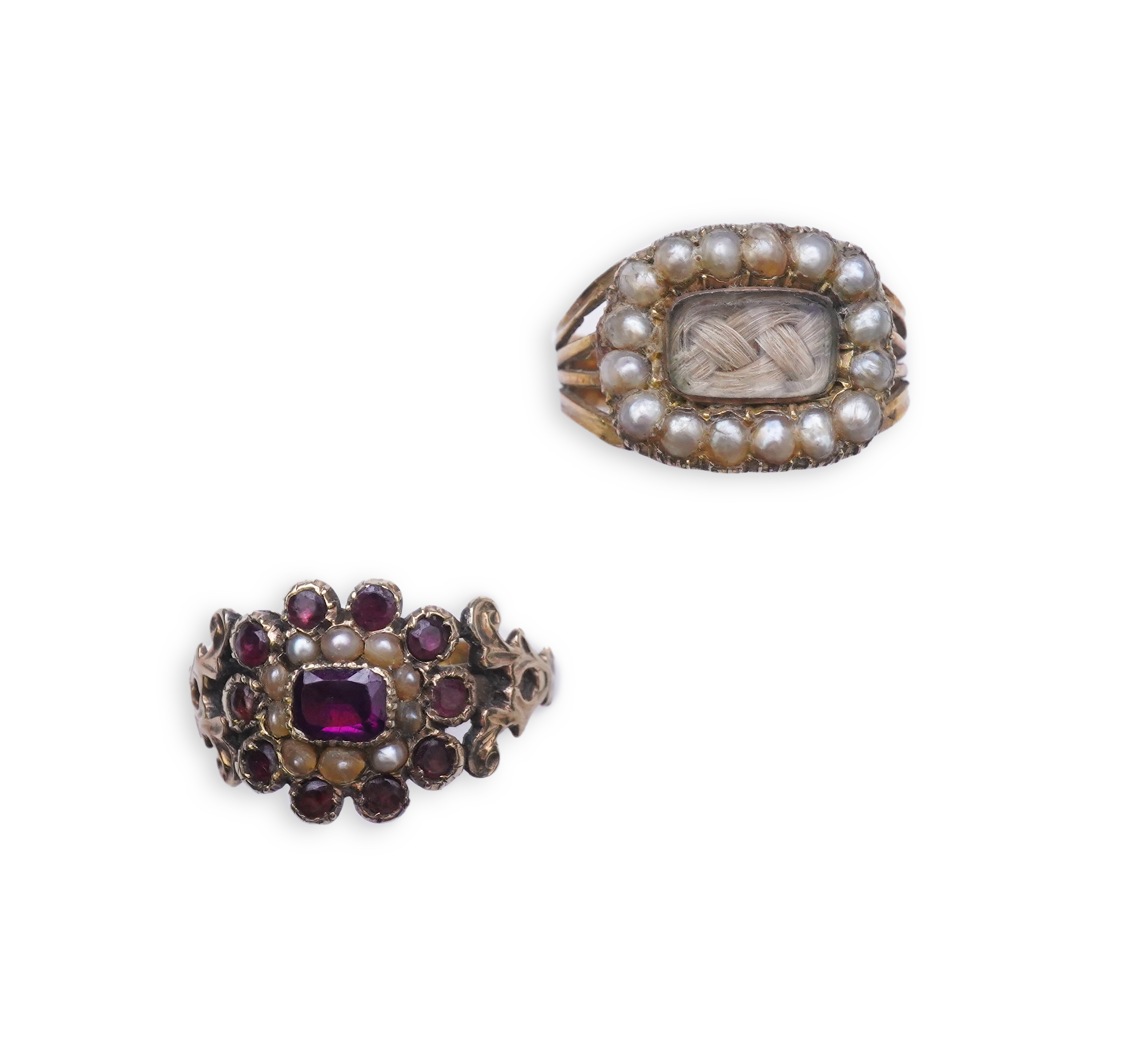 A George III seed pearl mourning ring and a garnet and seed pearl ring, mid 19th century